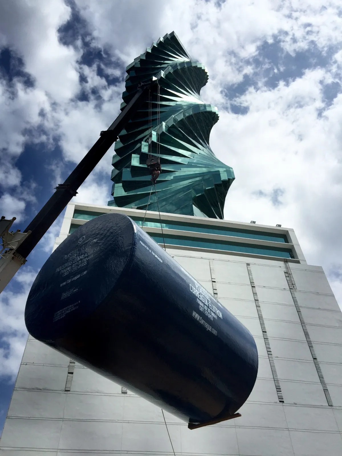 A Master Services fuel tank installation with a crane in front of the F&F Tower in Panama City